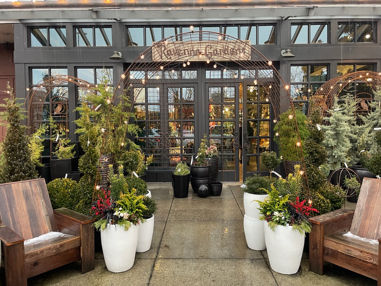 Ravenna Gardens Storefront with holiday lights and potted plants